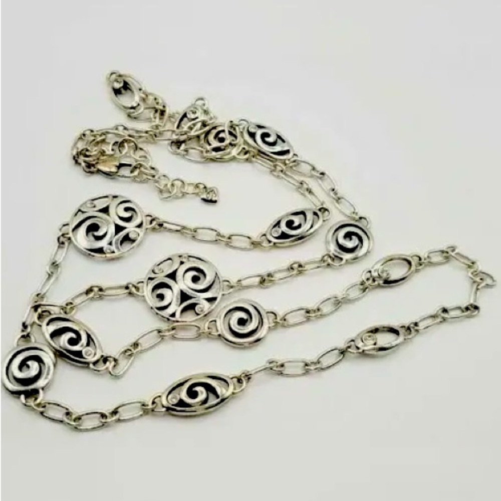 Brighton Mixed Vertigo 42 inch long necklace with clear crystals.
